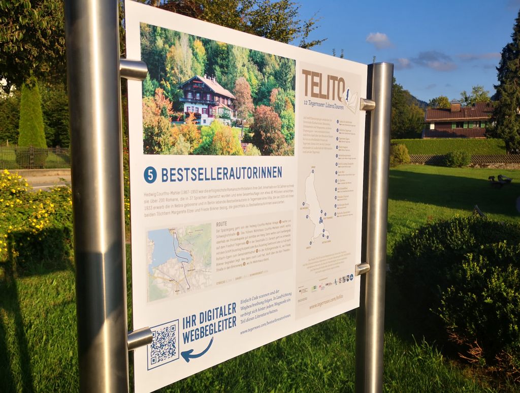 Die LiteraTour "Bestsellerautorinnen" beginnt in der Hedwig Courths-Mahler Anlage in Tegernsee-Süd